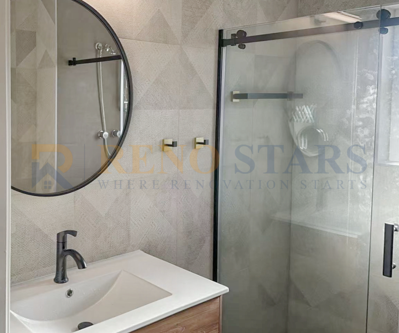 Modern bathroom featuring a round mirror, sleek faucet, and glass shower enclosure.