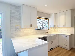 Kitchen Renovation with Apron Sink and Quartz Waterfall in Delta