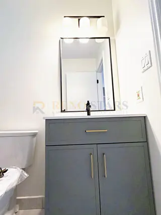 Kitchen Renovation with Apron Sink and Quartz Waterfall in Delta