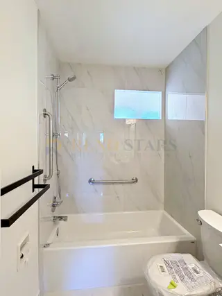 Kitchen Renovation with Apron Sink and Quartz Waterfall in Delta