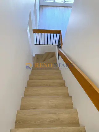New staircase with LVP treads and modern railing