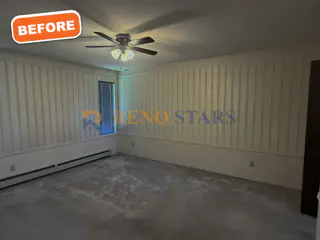 Wood-panel walls and carpet before renovation