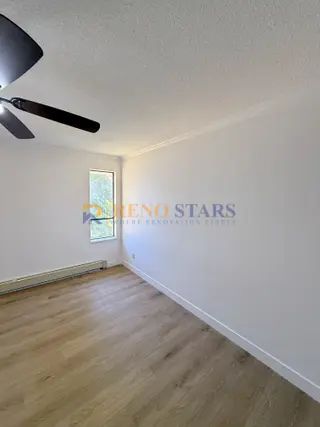 Refreshed bedroom with new flooring and paint