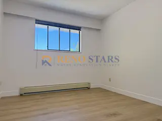 Bright neutral bedroom with LVP flooring